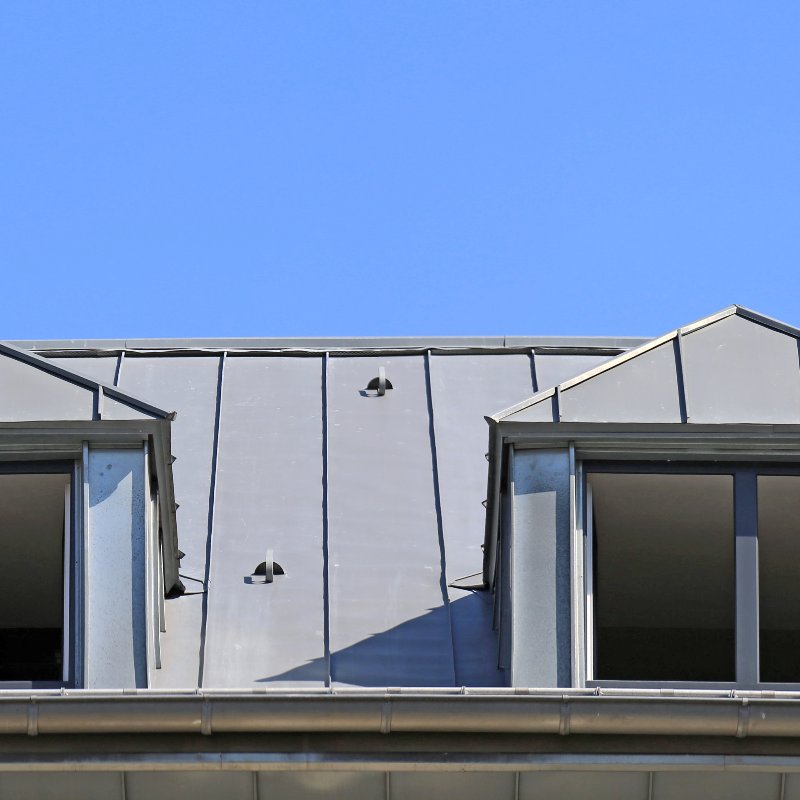 pair of dormers in a standing seam metal roof